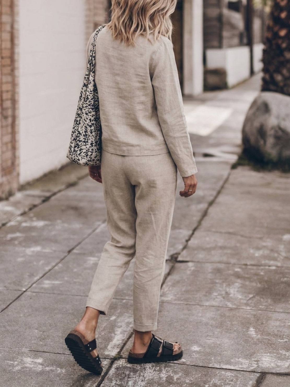 Woman wearing relaxed cotton-linen monochrome capsule outfit with longline top and wide-leg pants