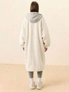 Back view of a person wearing a white oversized sherpa long coat with a gray hood, cozy and stylish everyday wear oversized coat.