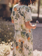 Woman wearing a loose fit co-ord set with a soft-tailored top and wide-leg bottoms in breathable cotton