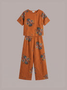 woman wearing soft-tailored loose fit co-ord set with wide-leg trousers in light beige cotton