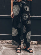 Woman wearing soft cotton loose fit co-ord set with relaxed top and wide-leg pants