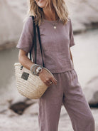 Woman wearing loose fit co-ord set with soft-tailored top and wide-leg cotton bottoms