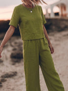 woman wearing loose fit co-ord set with soft-tailored top and wide-leg bottoms