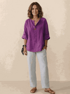 White pure linen age-defying shirt with button details and breathable fabric
