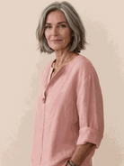 White pure linen age-defying shirt with button detail on a hanger