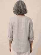 White pure linen age-defying button detail shirt displayed on a mannequin
