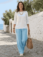 Two women modeling Casual Chic Duo breathable natural fabric outfits, relaxed fits with mix-and-match styling options