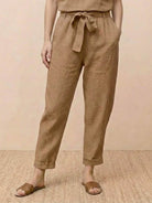 Cotton linen monochrome straight-leg pants with adjustable drawstring waist and breathable fabric texture