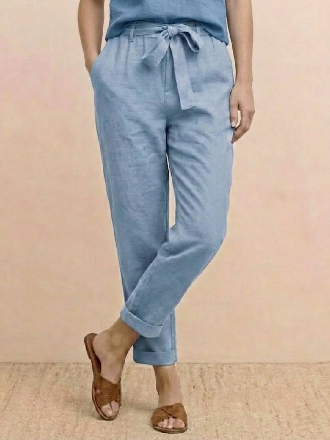 Woman wearing 100% cotton linen monochrome co-ord set with relaxed short-sleeve top and straight-leg pants