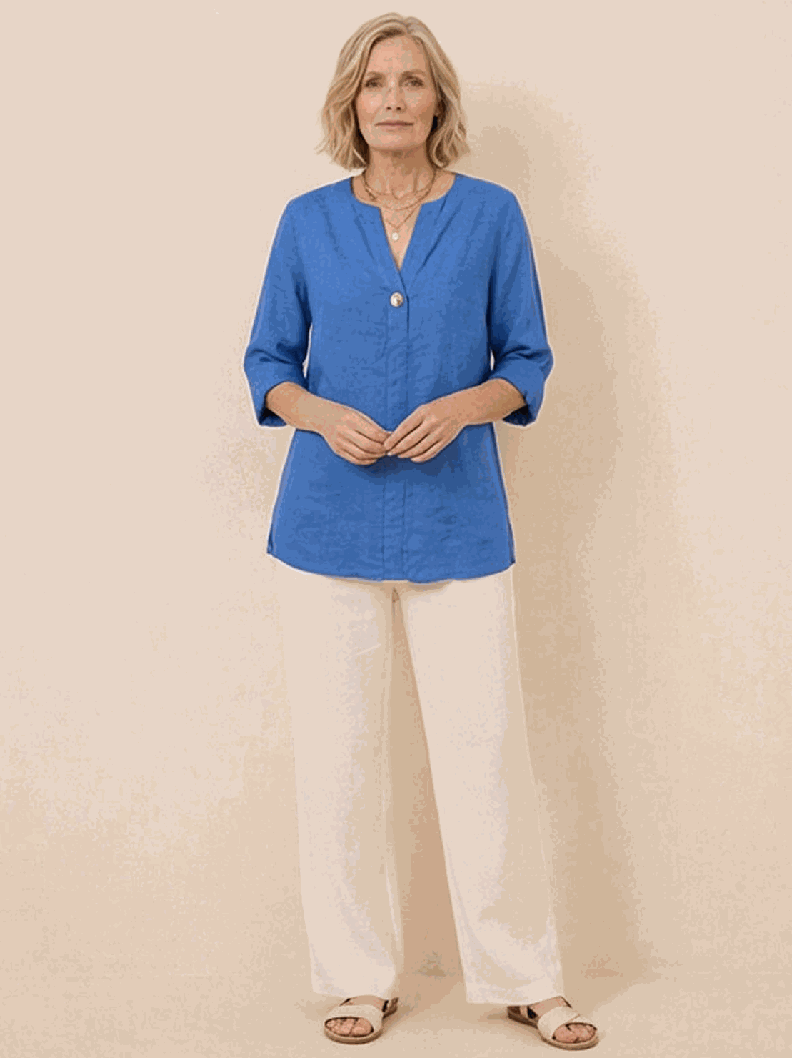pure linen age-defying shirt with button detail on hanger against white background
