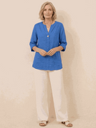pure linen age-defying shirt with button detail on hanger against white background