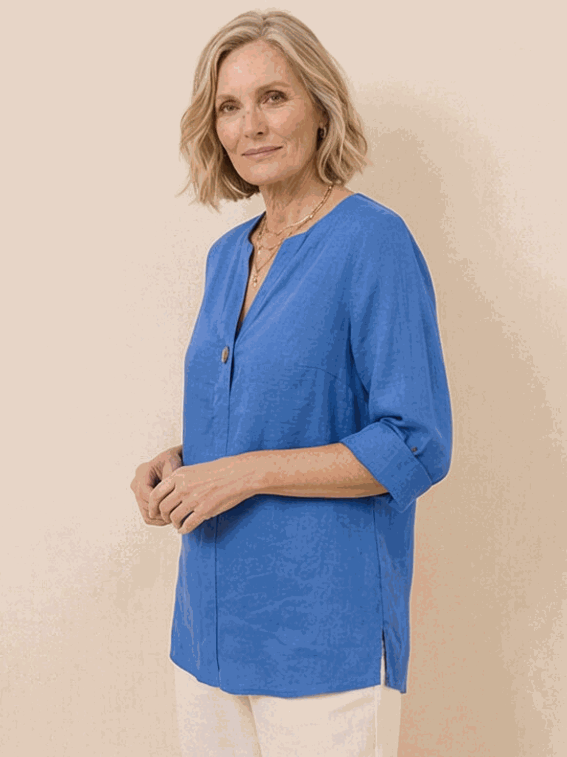 white pure linen age-defying shirt with button detail on wooden hanger