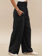 Black high-waist cotton linen palazzo pants with wide legs and pockets for women.