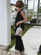 Loose solid color sleeveless two-piece set laid flat with size chart and product details