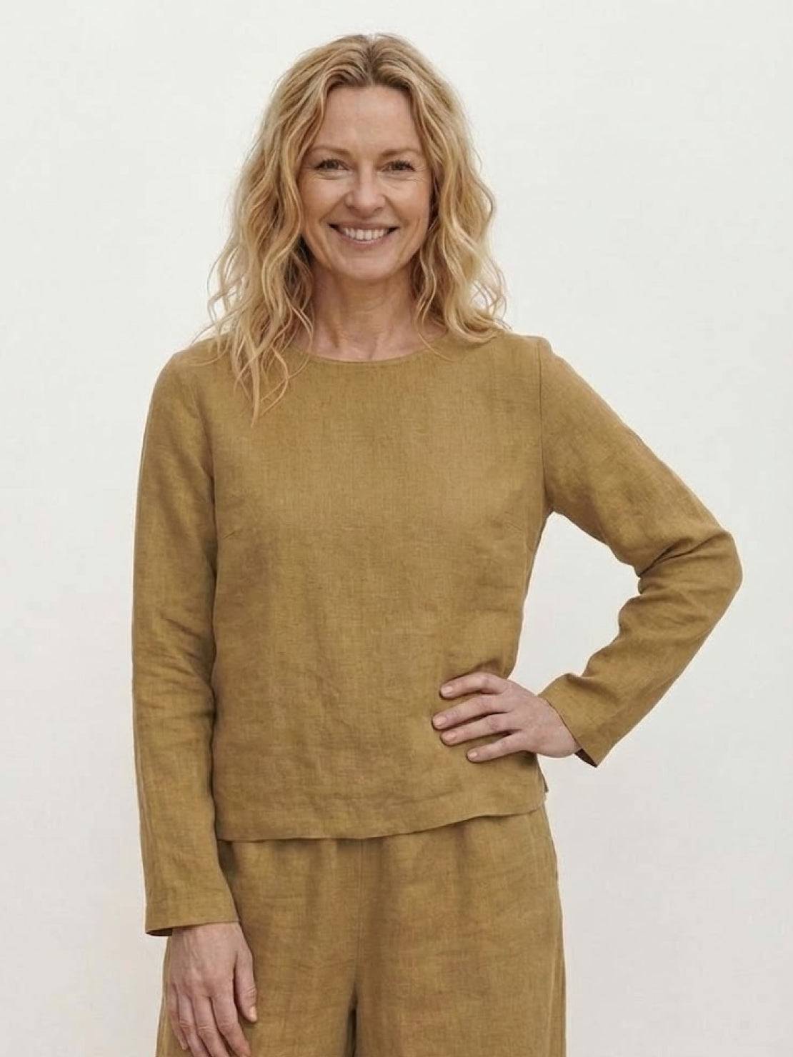 Loose solid color two-piece set with loose fit pullover and wide-leg pants in breathable cotton blend fabric