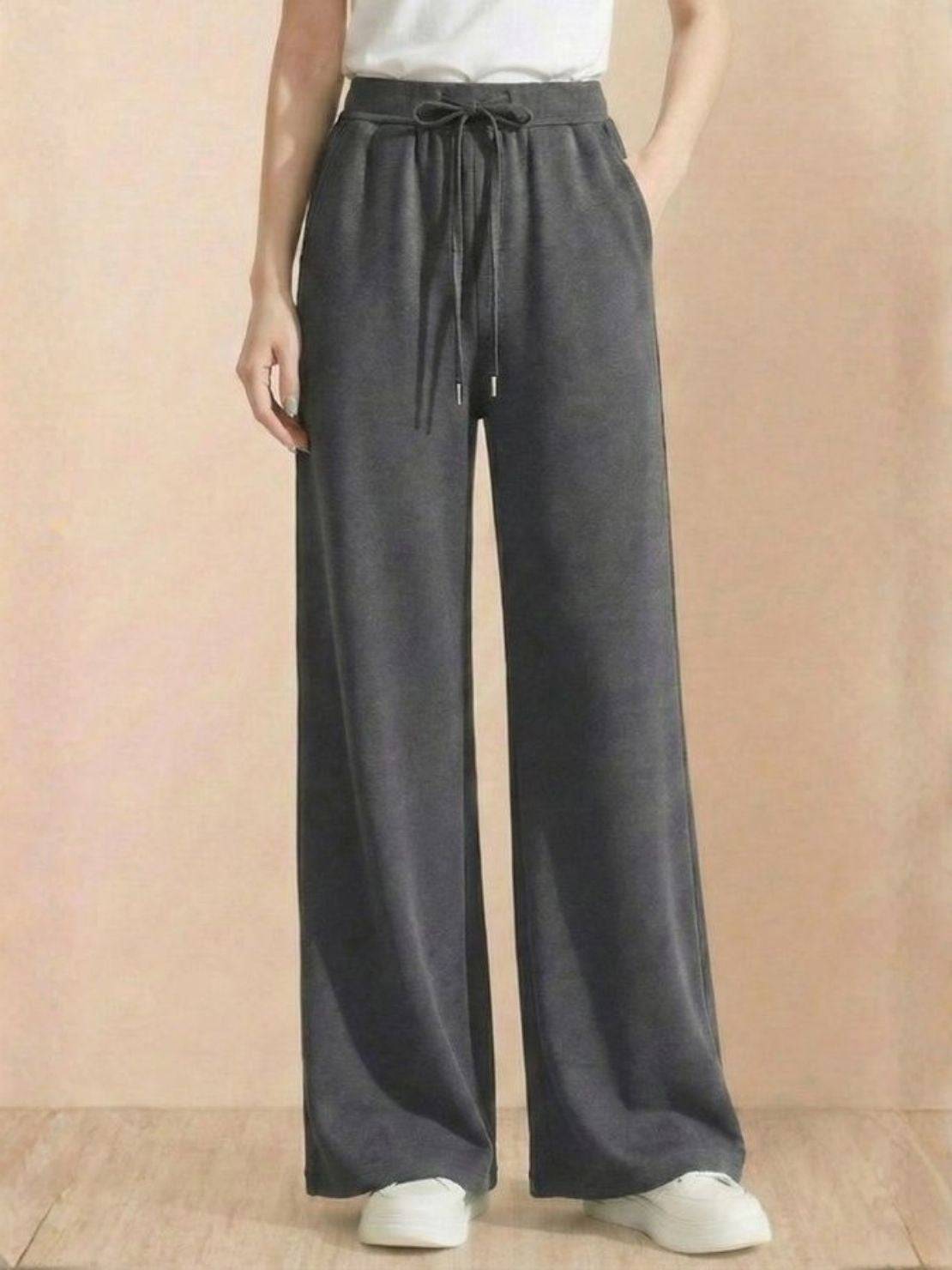 Wide-leg lyocell-blend fleece pants with elastic waist and drawstring.