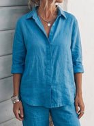 Woman wearing an oversized 100% cotton shirt and wide-leg pants co-ord set in a relaxed, breathable style