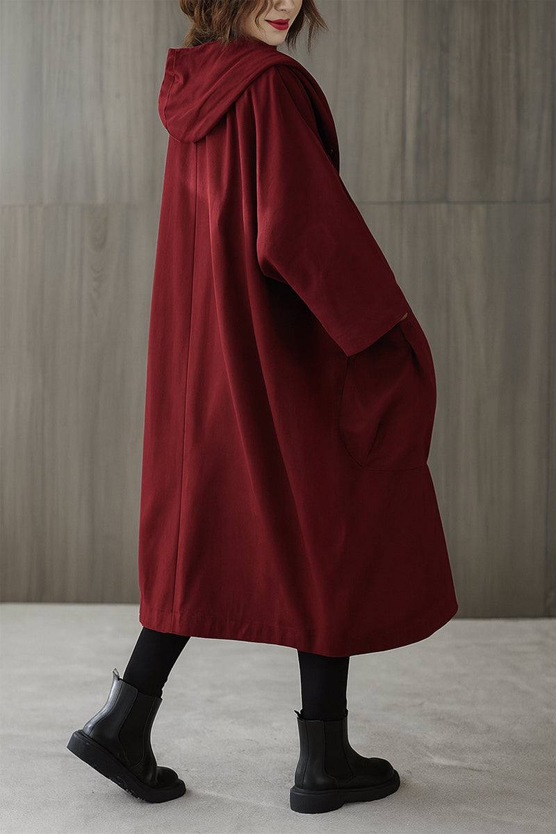 One-size oversized heritage windbreaker jacket in deep red with attached hood and large pockets, lightweight and water-resistant.