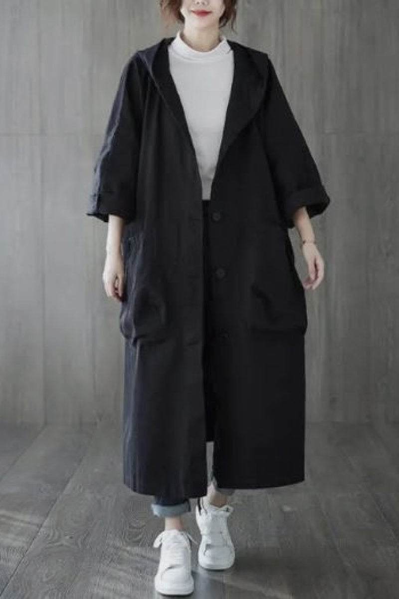 One-size oversized black Heritage Windbreaker Jacket with attached hood and large front pockets for layering and weather protection