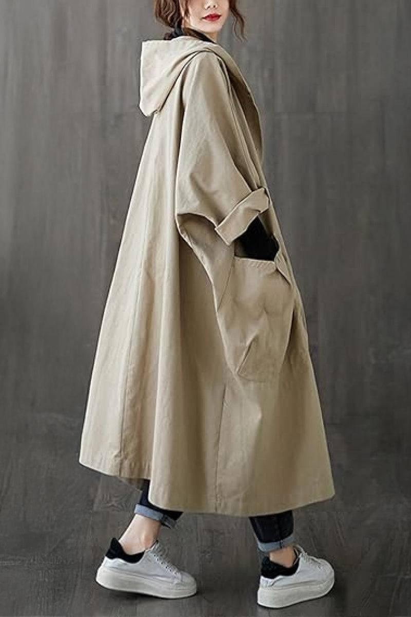 One-size oversized Heritage Windbreaker Jacket in beige with attached hood, snap-button closure, and large front pockets, lightweight and water-resistant.