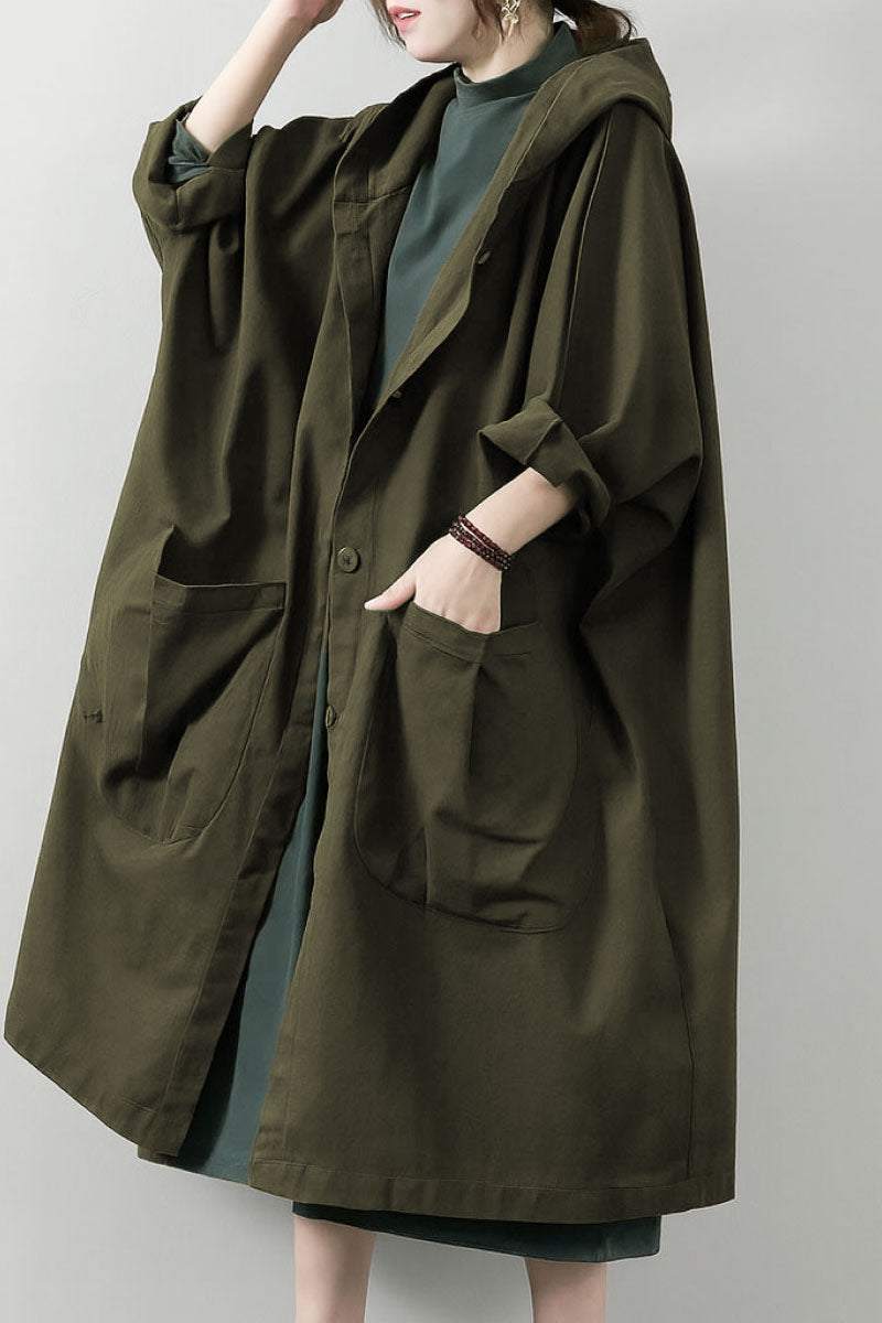 Oversized one-size Heritage Windbreaker Jacket in olive green with attached hood and large front pockets, lightweight and water-resistant.