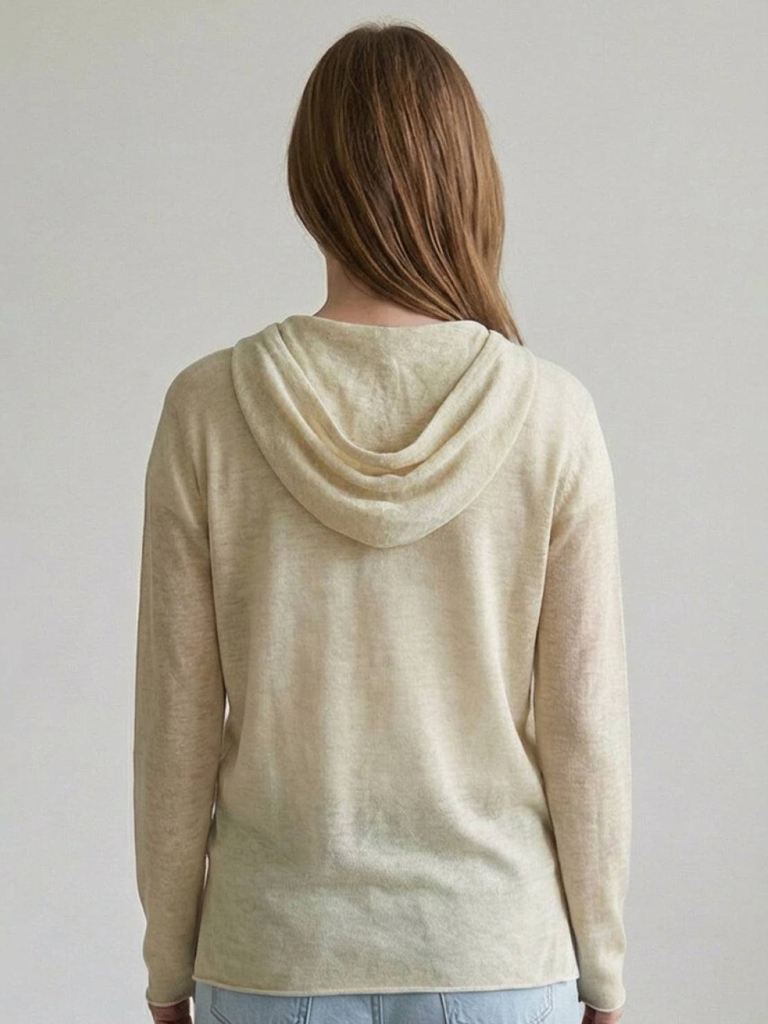 organic linen henley top with fine knit, relaxed fit, 3-button placket, long sleeves, and side slits in neutral heathered fabric