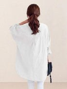 Oversized linen shirt with breathable cotton blend and vintage back button detail