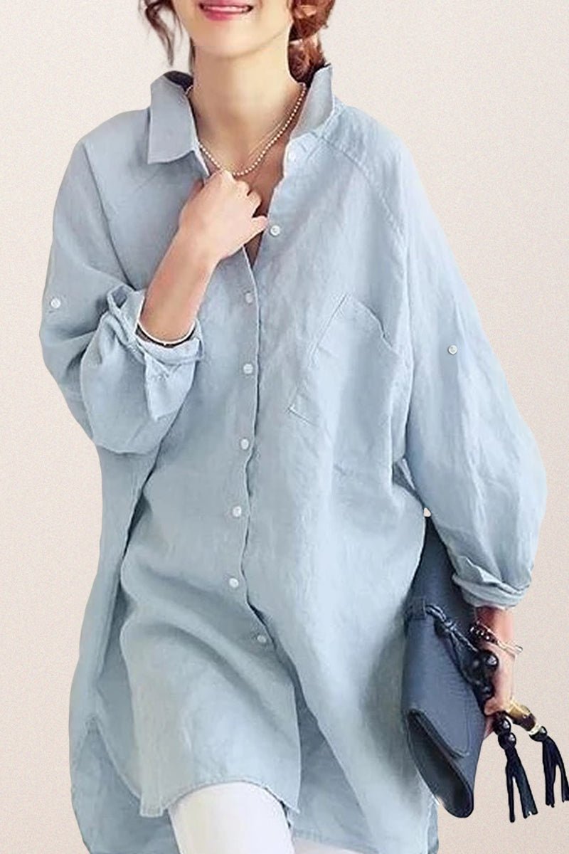 Light blue oversized linen shirt with button-down front and loose sleeves worn casually by woman