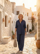 Model wearing an oversized 100% cotton shirt and wide-leg pants co-ord set in a relaxed style