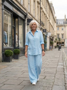 Model wearing oversized 100% cotton shirt with wide-leg pants co-ord set in a relaxed fit