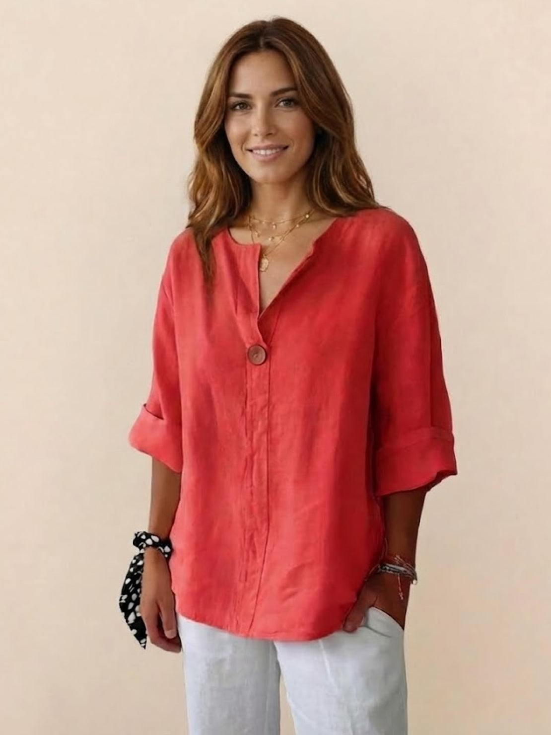Pure linen age-defying shirt with button detail, lightweight and breathable fabric.