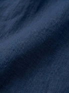 Close-up of soft breathable pure linen fabric in navy blue for Pure Linen Age-Defying Shirt
