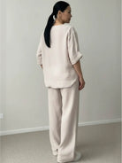 Pure linen two-piece casual comfort set in light breathable fabric with button-up top and matching pants