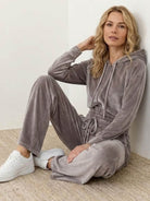Modern cropped velour tracksuit set with high-waist pants in plush polyester fabric