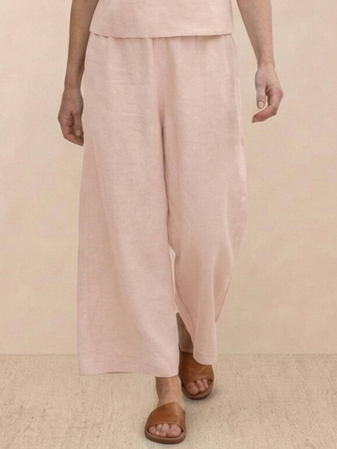 Woman wearing The Meadow loose fit co-ord set with soft-tailored top and wide-leg bottoms in solid color