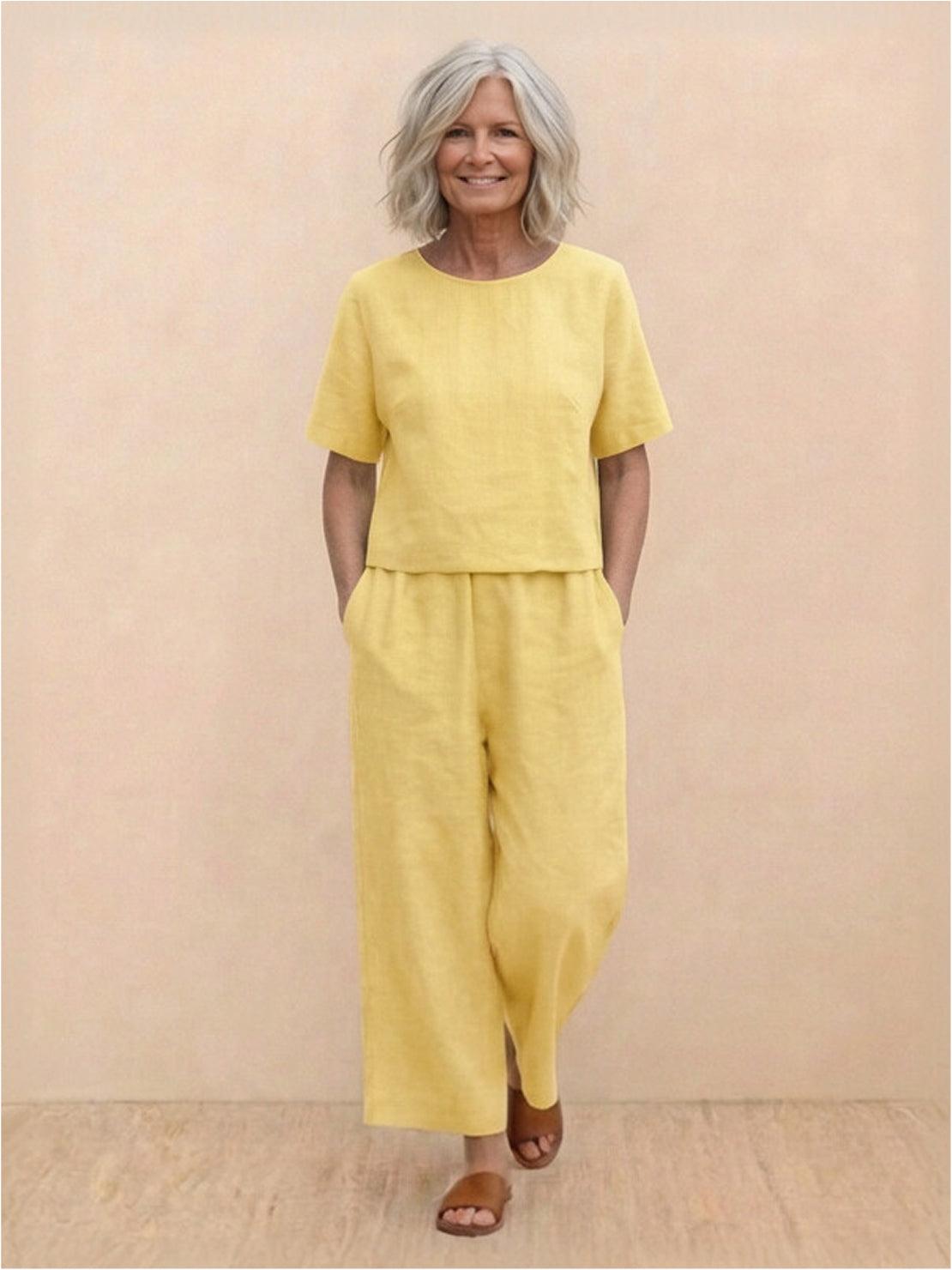 Woman wearing a loose fit co-ord set with soft-tailored top and wide-leg bottoms in a breezy fabric