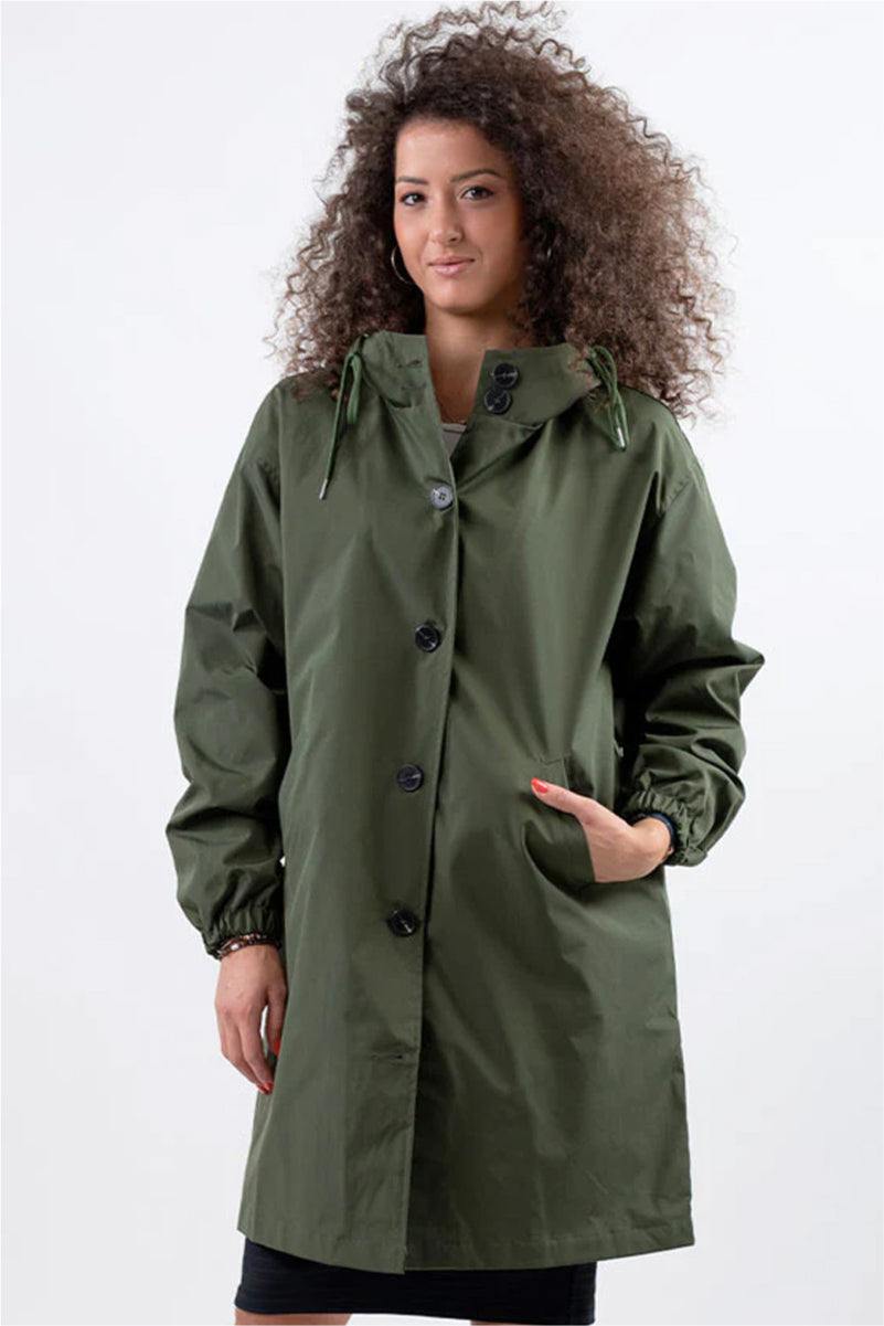 Woman wearing oversized olive green Rain Couture Windbreaker jacket with hood and pockets