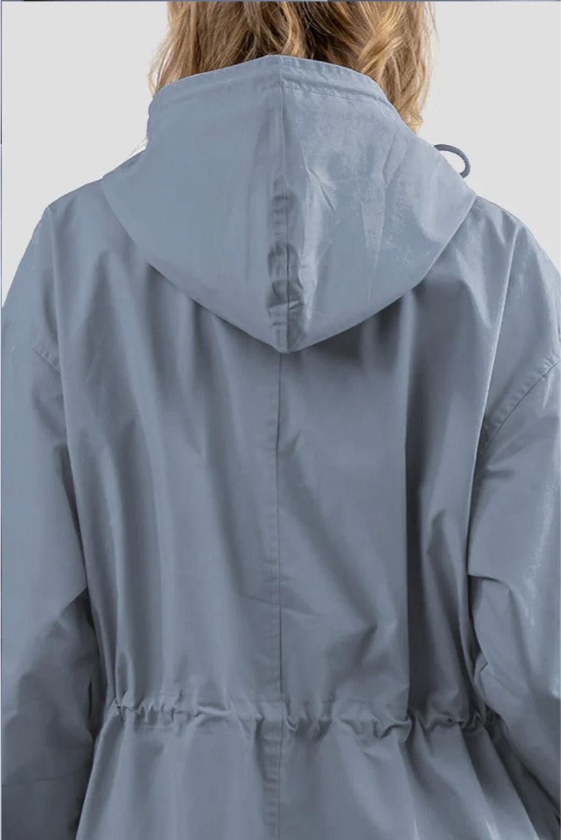 Back view of a light blue Rain Couture Windbreaker with an adjustable hood and cinched waist, made from water-resistant fabric.