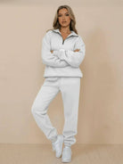 woman wearing white ultra-soft and comfy co-ord tracksuit set with zip-up top and jogger pants