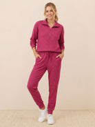 Unisex half-zip pullover and sweatpants set in relaxed fit with soft fabric for casual wear and travel