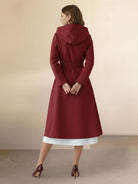 Water-repellent A-line hooded raincoat with insulated lining and matching belt for women