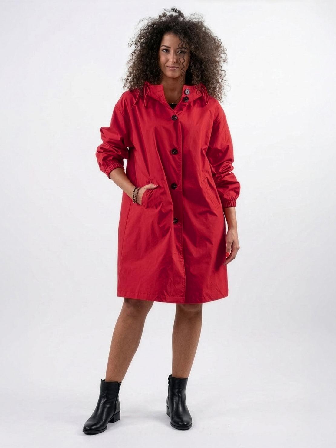 water-resistant oversized windbreaker rain jacket in outdoor setting